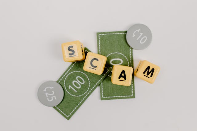 Close-up shot of fake money and dice spelling 