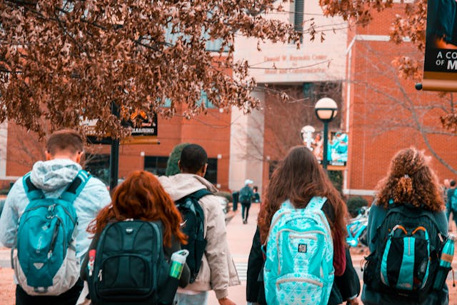 Group of students walking and wearing backpacks